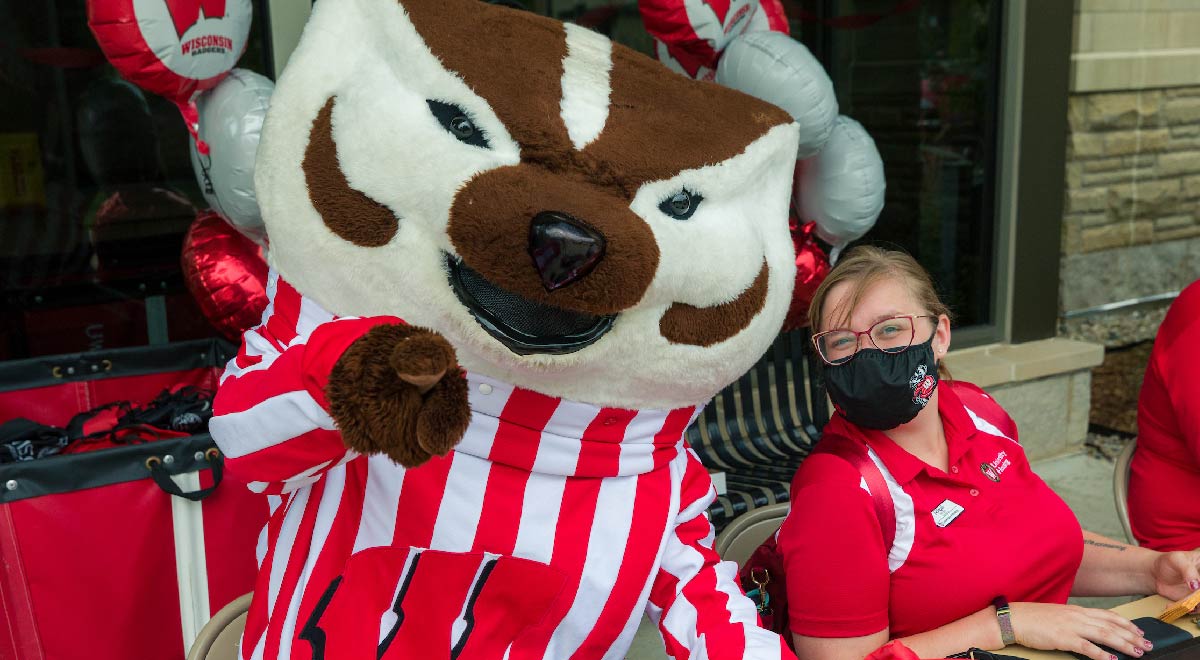 Housing staff poses with Bucky Badger during Move-In