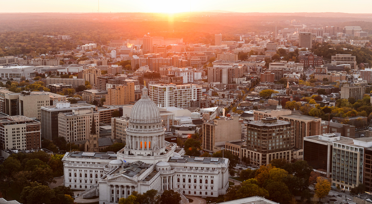 Aerial photo of the Wisconsin State Capitol and surrounding buildings at sunset