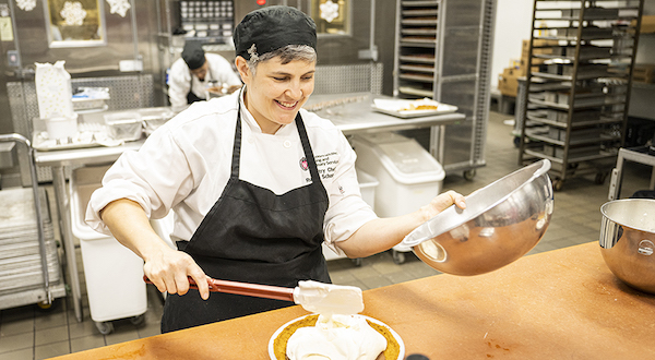 A University Housing Pastry Chef prepares a fudge bottom pie in the Gordon kitchen