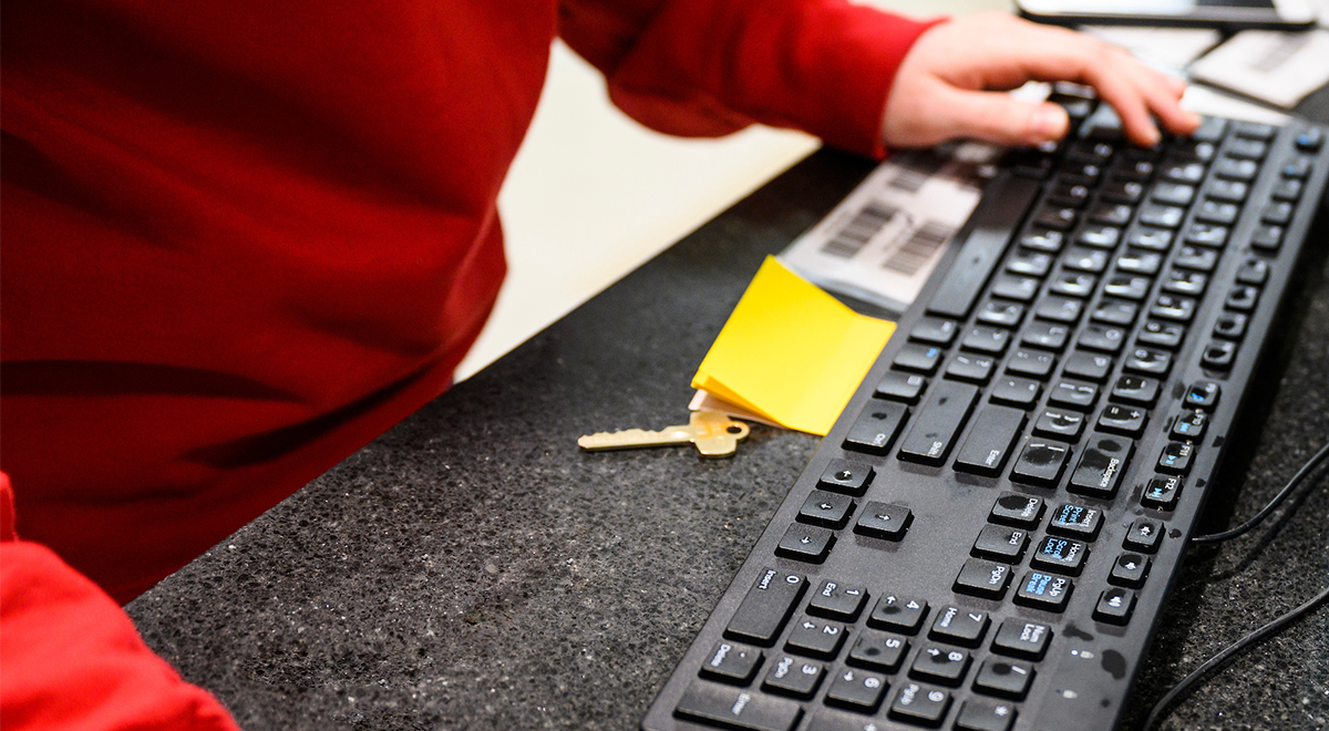 Person typing on a keyboard