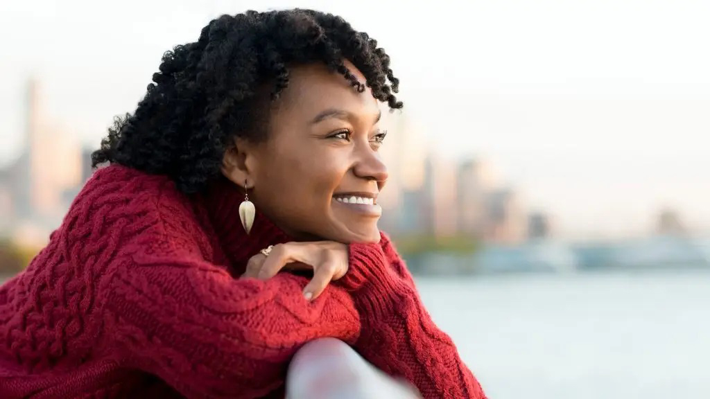 Woman sitting outside smiling