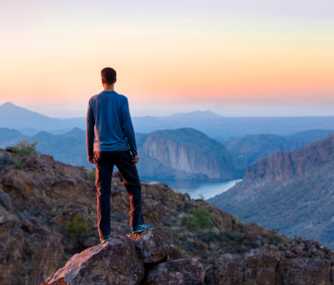 Man standing on rocky mountains