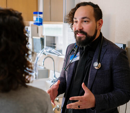 Physician speaking with a patient