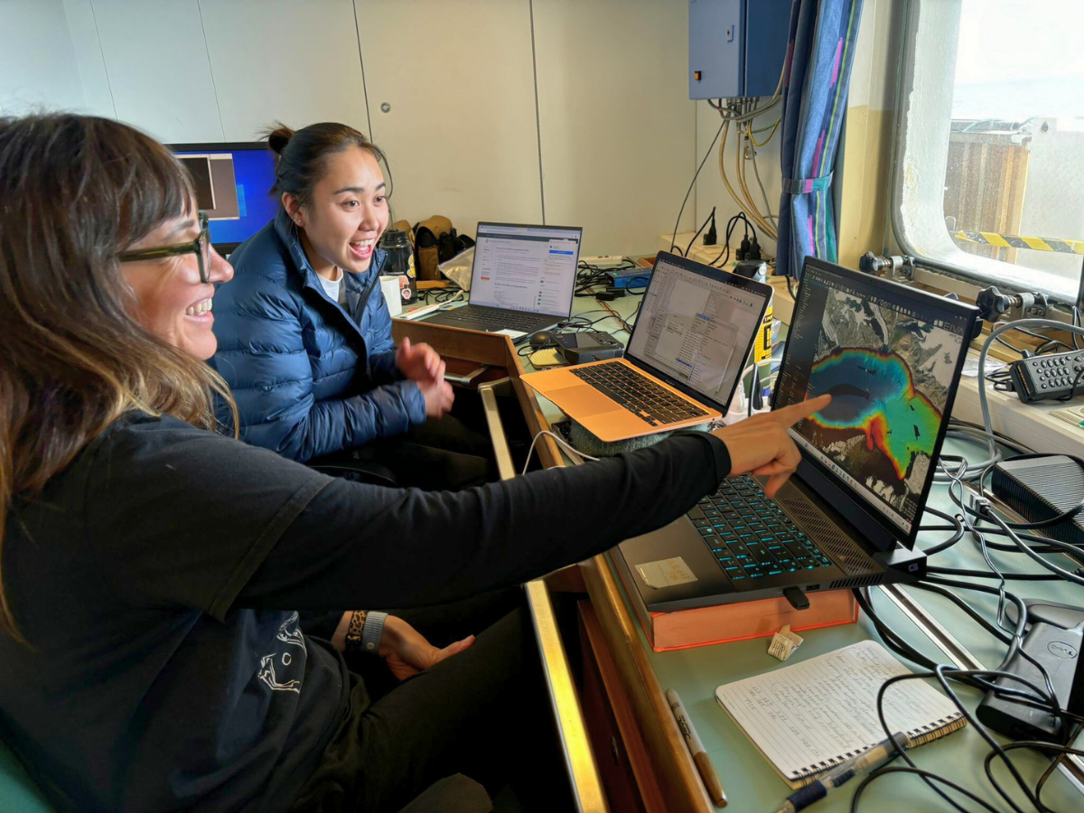 UTIG researchers analyzing data on computer