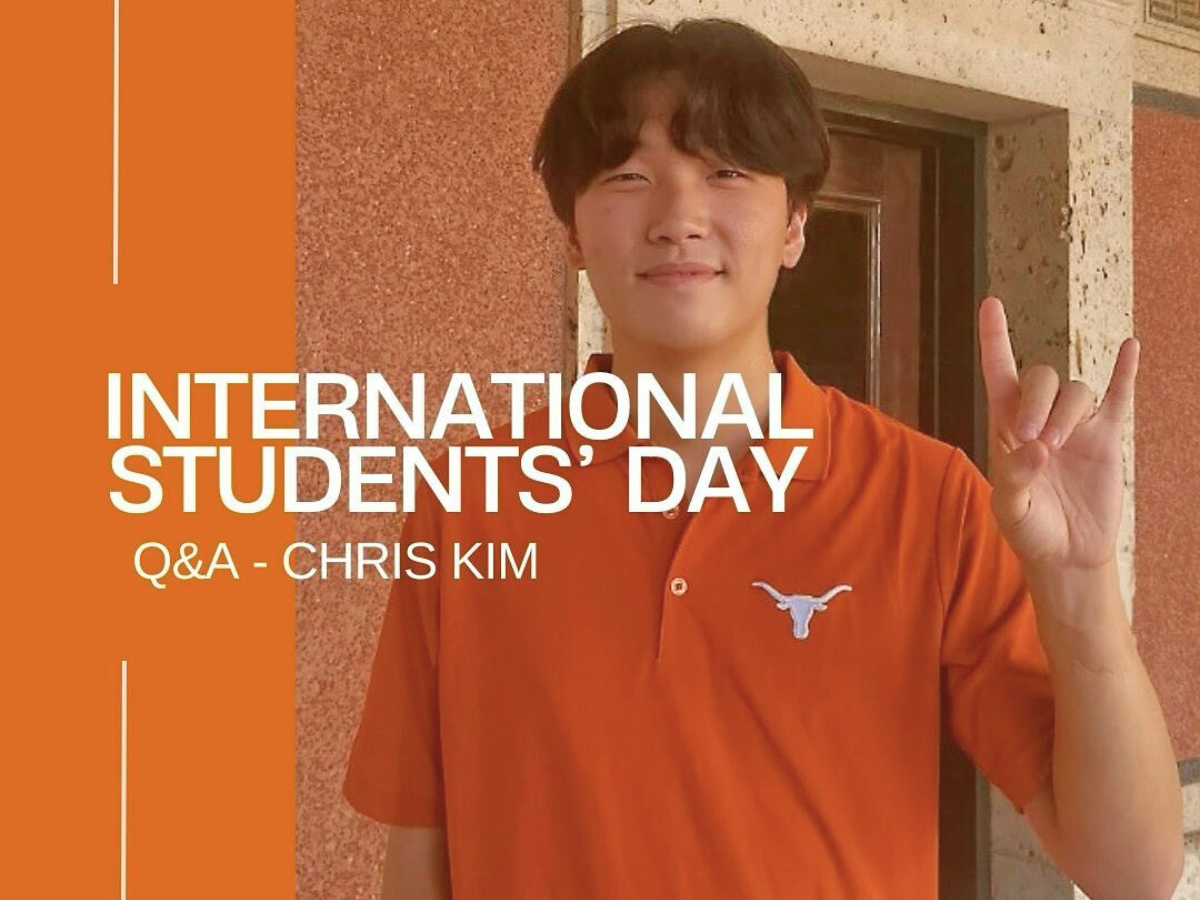 International student doing hook' em