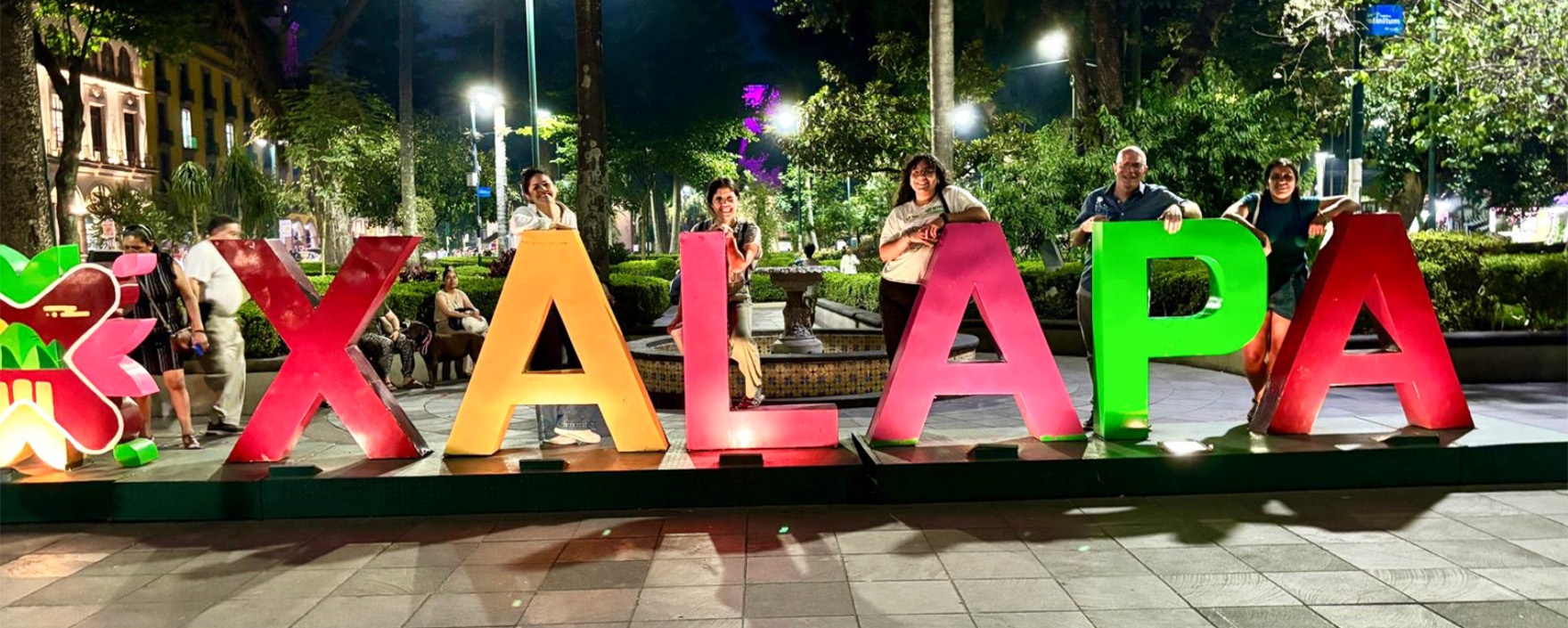 Music scholars posing with Xalapa sign