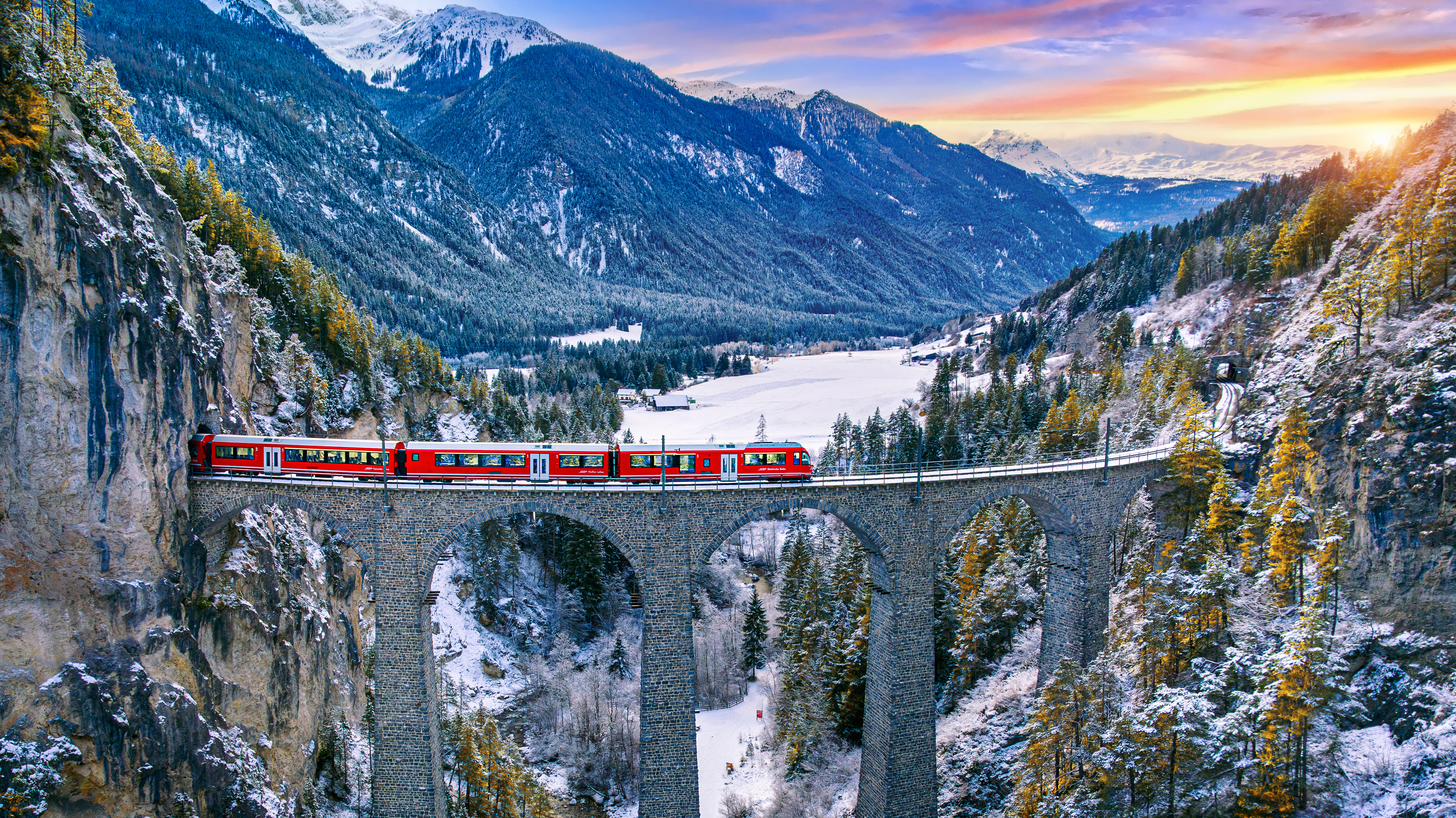 Train passing through mountain in Filisur, Switzerland