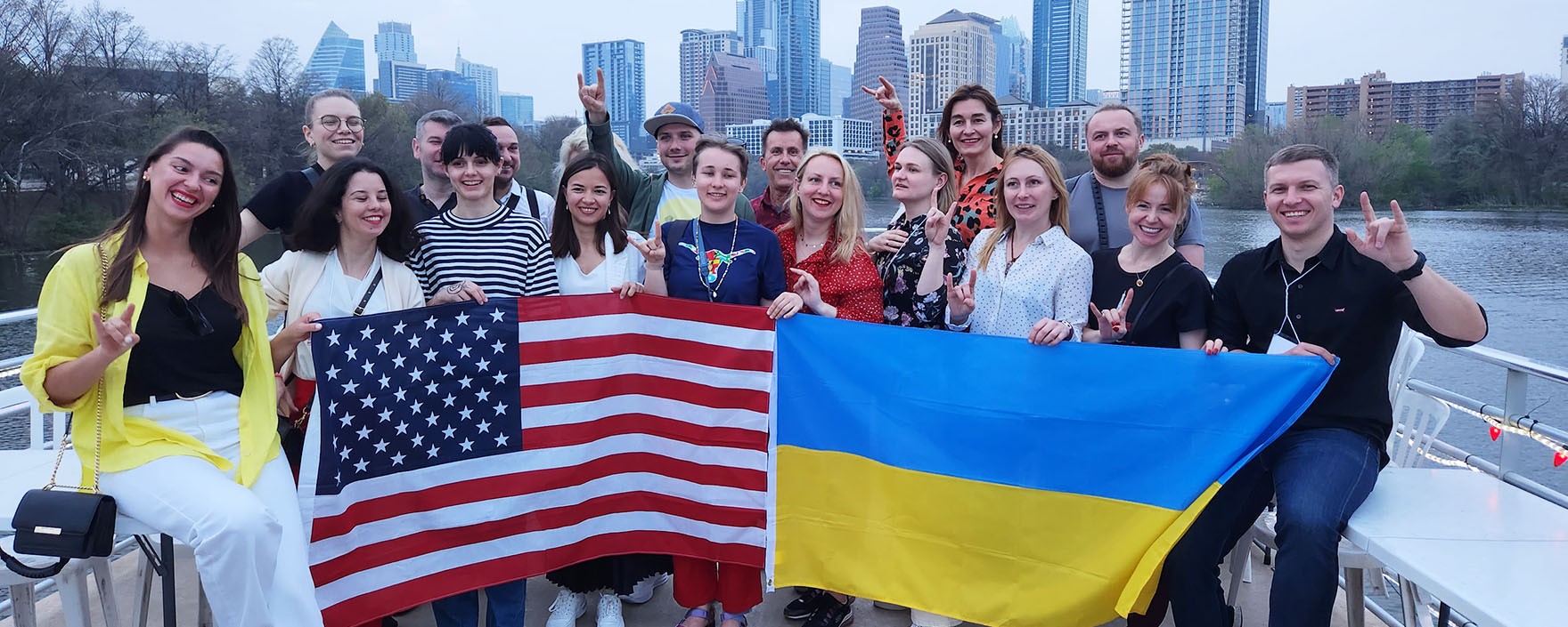 Ukrainian Business Leaders cohort posing with Austin skyline in background