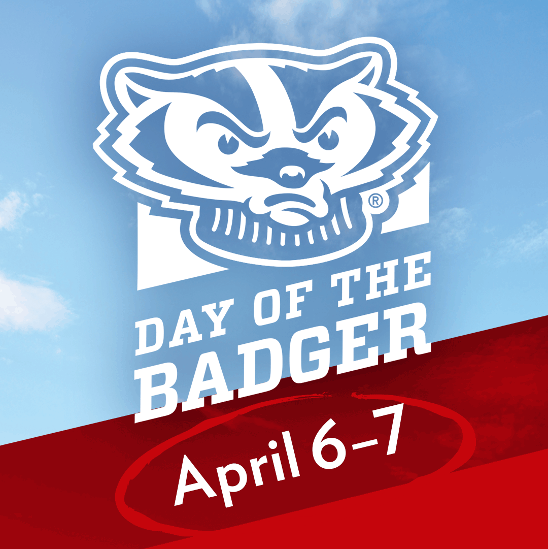 White Day of the Badger logo in front of a blue cloudy sky.