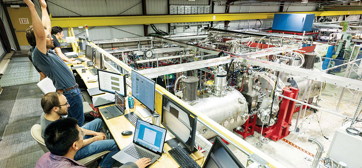 Researchers celebrate as they reach first plasma.