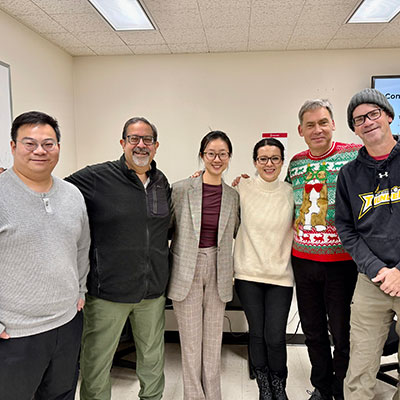 Six members of Mengyu Li's dissertation committee pose together after Mengyu's dissertation defense.