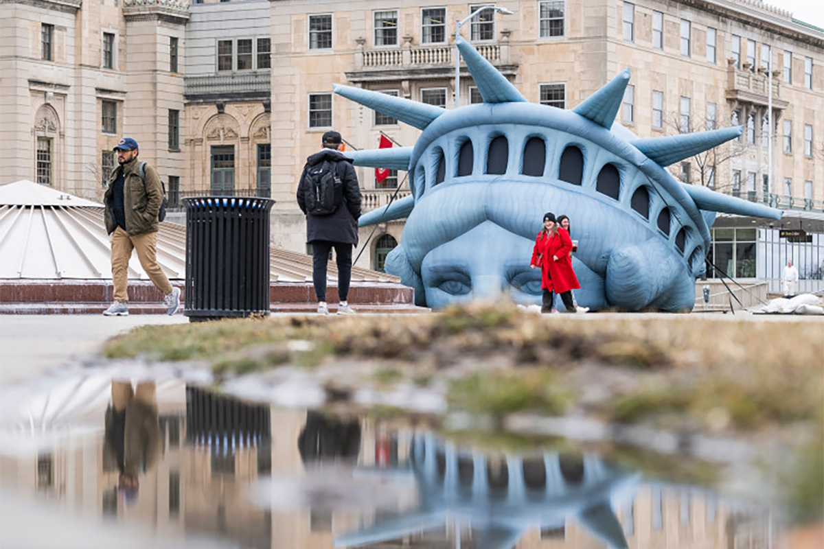 Inflatable replica of Lady Liberty head placed in Library Mall, Madison, WI