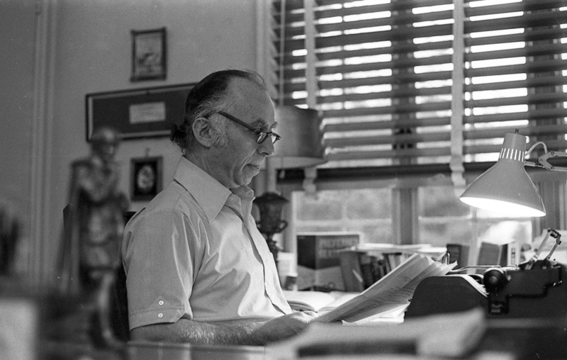 Alvin Boretz sits at his desk, looking down at papers.