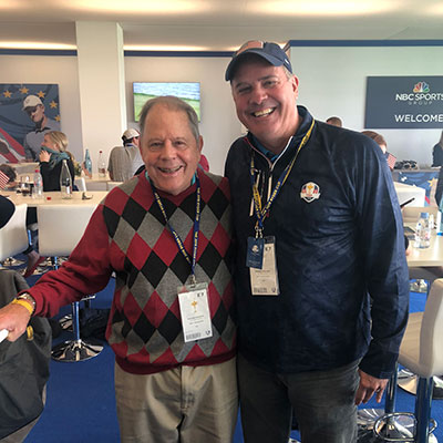 Rudy Martzke poses with Greg Hughes at the Ryder Cup in 2018