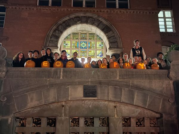 Geography Club students pose with pumpkins carved to read GEOGRAPHY