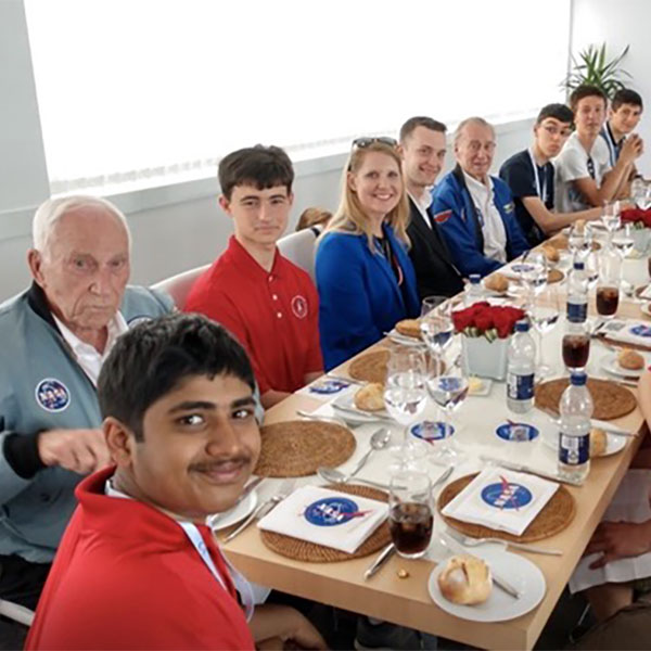 Nathan Wagner and his high school rocket club having lunch with Apollo 15 Astronaut.