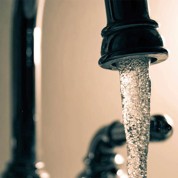 Clear tap water coming out of home faucet.
