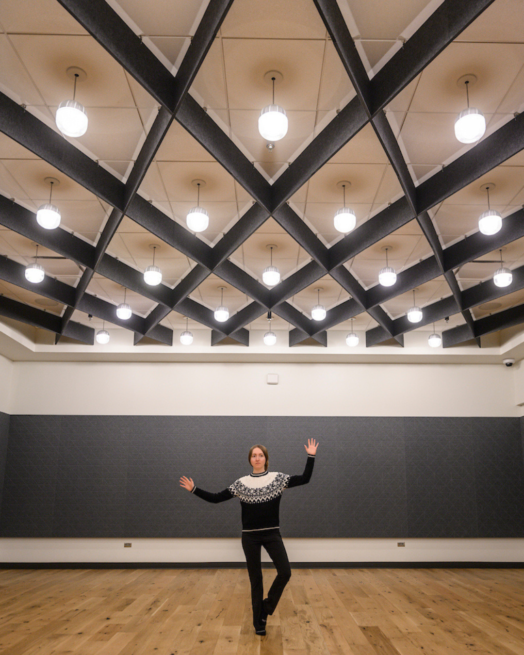 A Rec Well student employee strikes a tree pose in the Bakke meditation room.