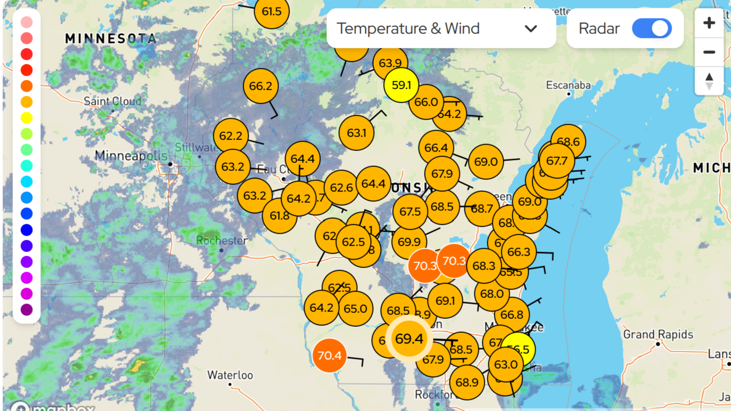 A map of Wisconsin with dots representing temperature and a storm floating over.