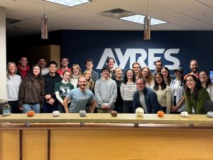 Geography students, staff, and Ayres Associates employees pose together