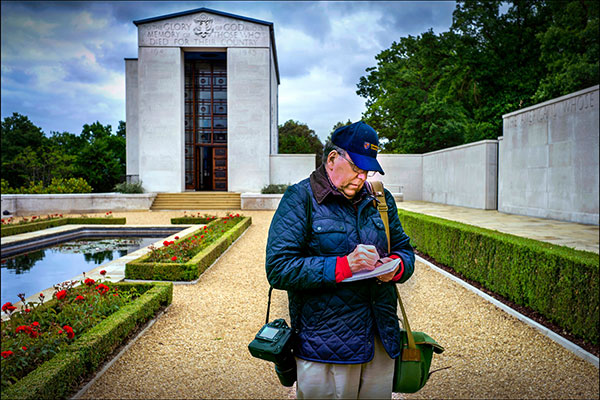 Steve Raymer make a note while on assignment for National Geographic