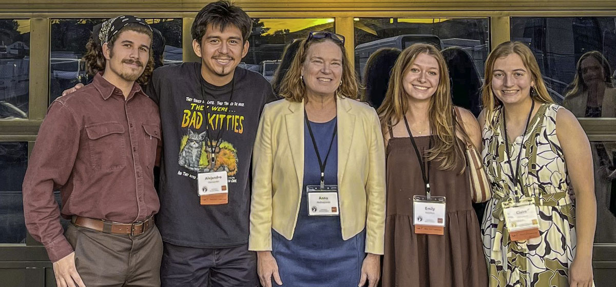 Prof. Anna Andrzejewski with four UW–Madison student ambassadors at closing night of architecture conference.
