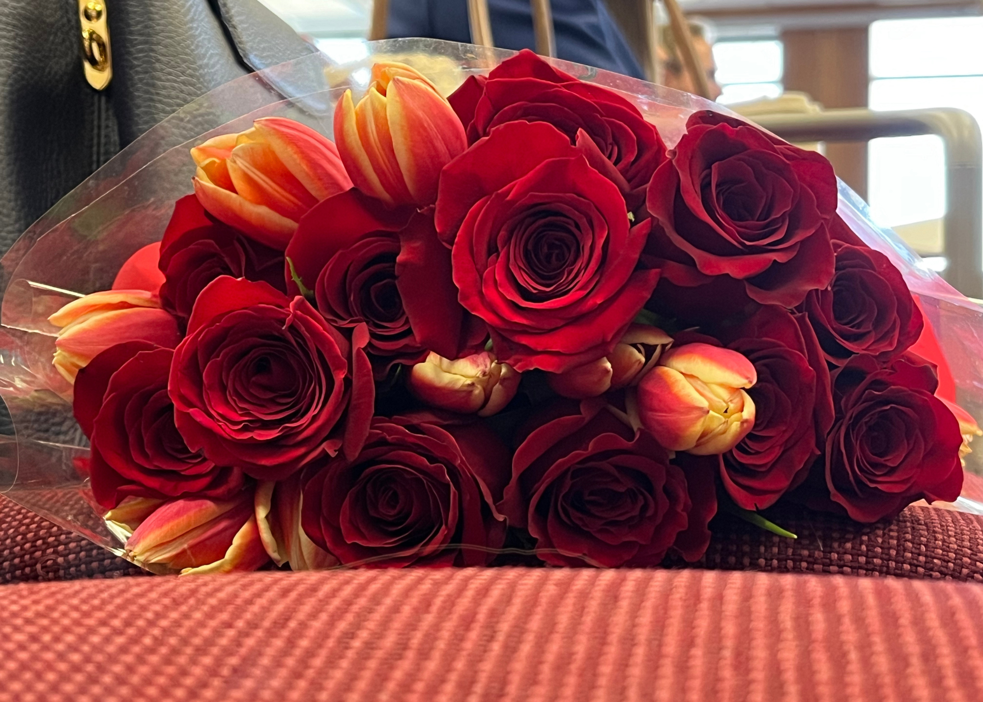 A bouquet of roses and tulips.