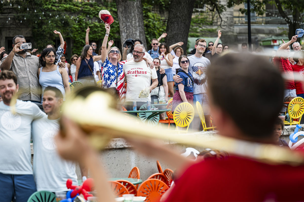 A crowd at the Memorial Union Terrace sings along to "Varsity" on the Fourth of July.