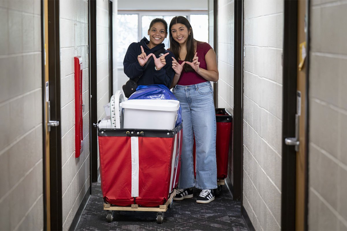 Campus Move in new students with red carts..