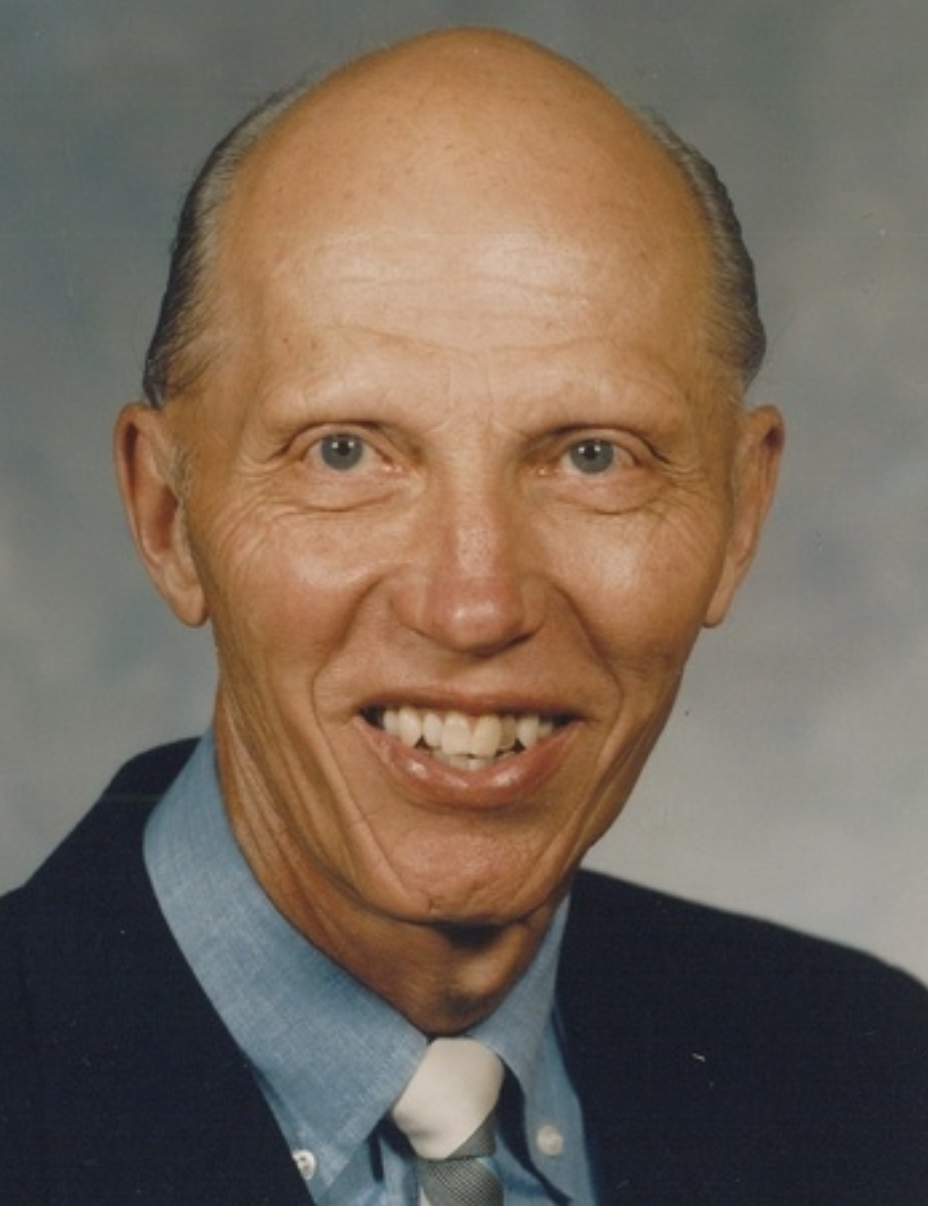 Robert Forsberg smiles for a professional photograph.