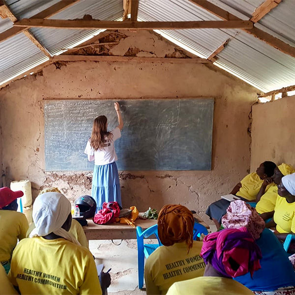 Jess Randall teaching a group of women in Africa.