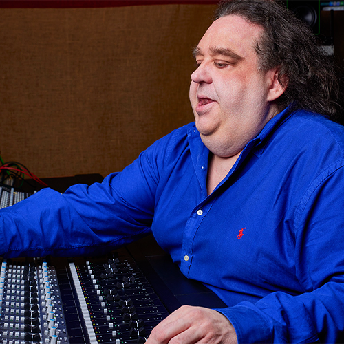 Photo of musician Joey Stuckey in the studio.
