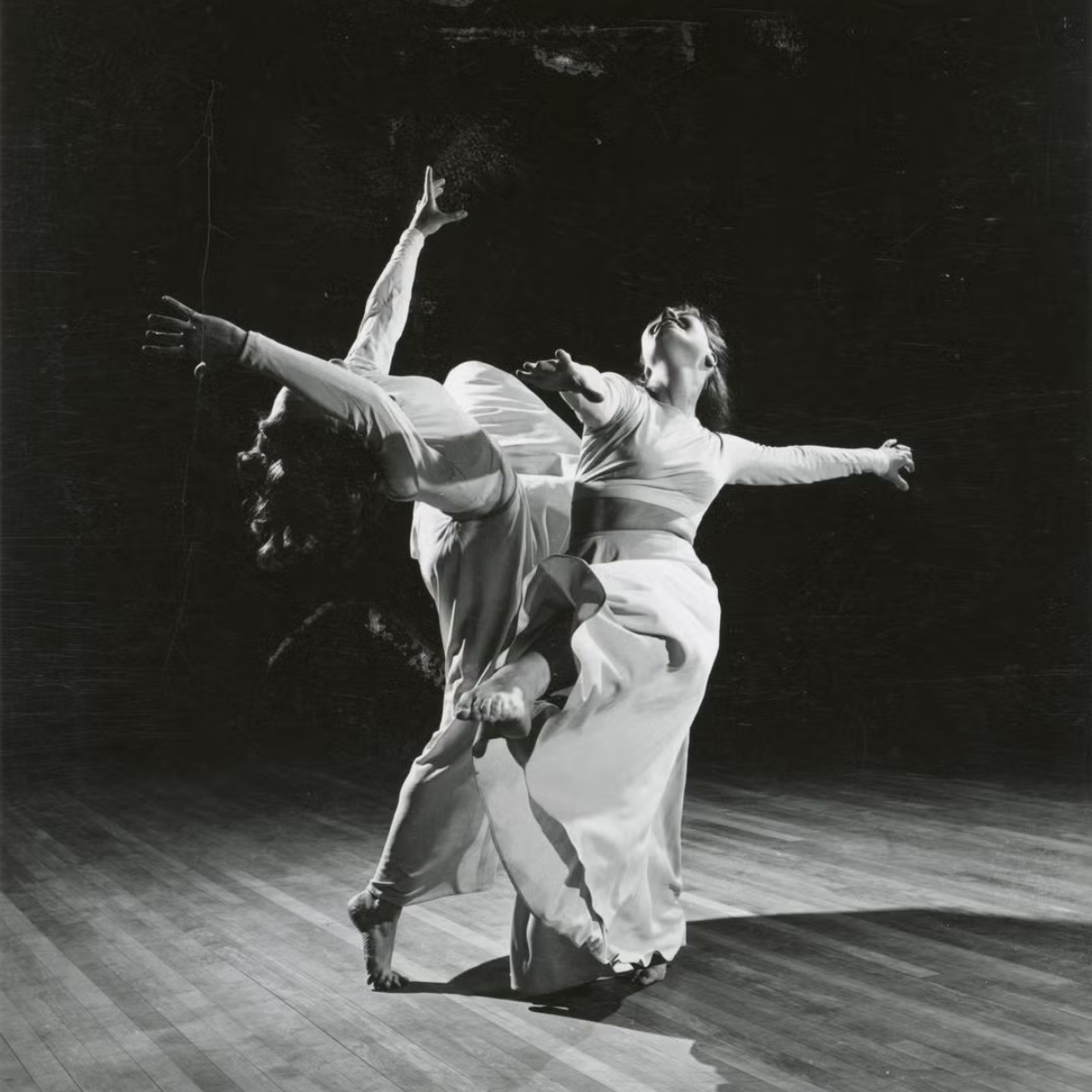 Two members of student dance group Orchesis perform on a stage (date unknown). Photo courtesy UW-Madison Archives.