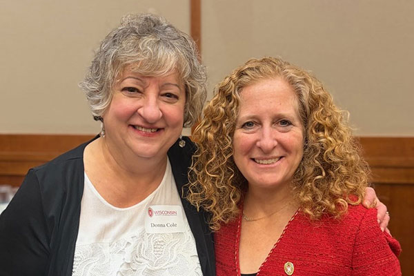 Donna Cole, left, poses with University of Wisconsin–Madison Chancellor Jennifer Mnookin