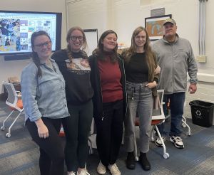 Five students pose in the Cart Lab