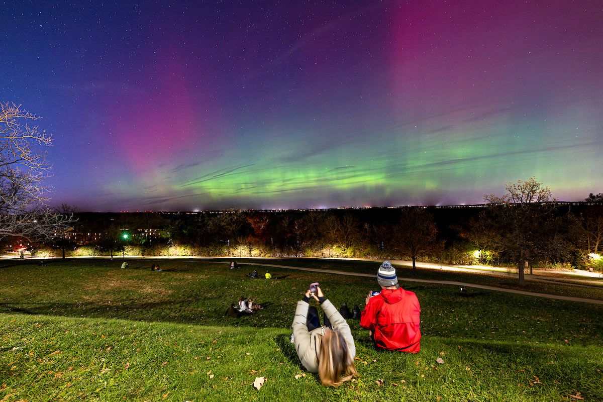 People gather on Observatory Hill to watch Aurora Borealis, 2025.