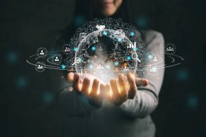 Hands holding an image of the world surrounded by data