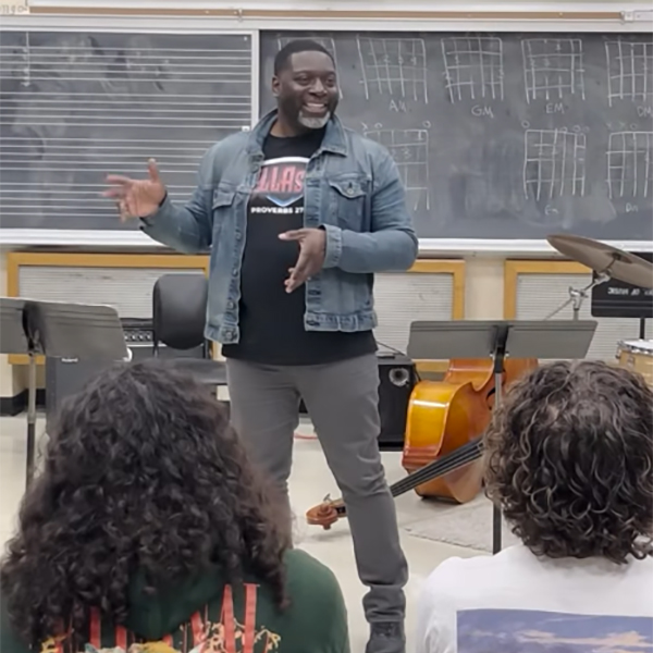 Jamar Jones addresses students in music classroom