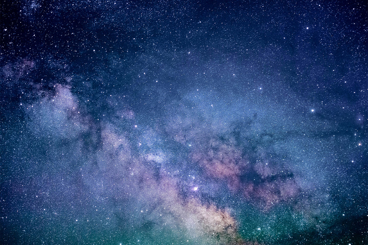 Blue and purple colorful galaxy of stars.