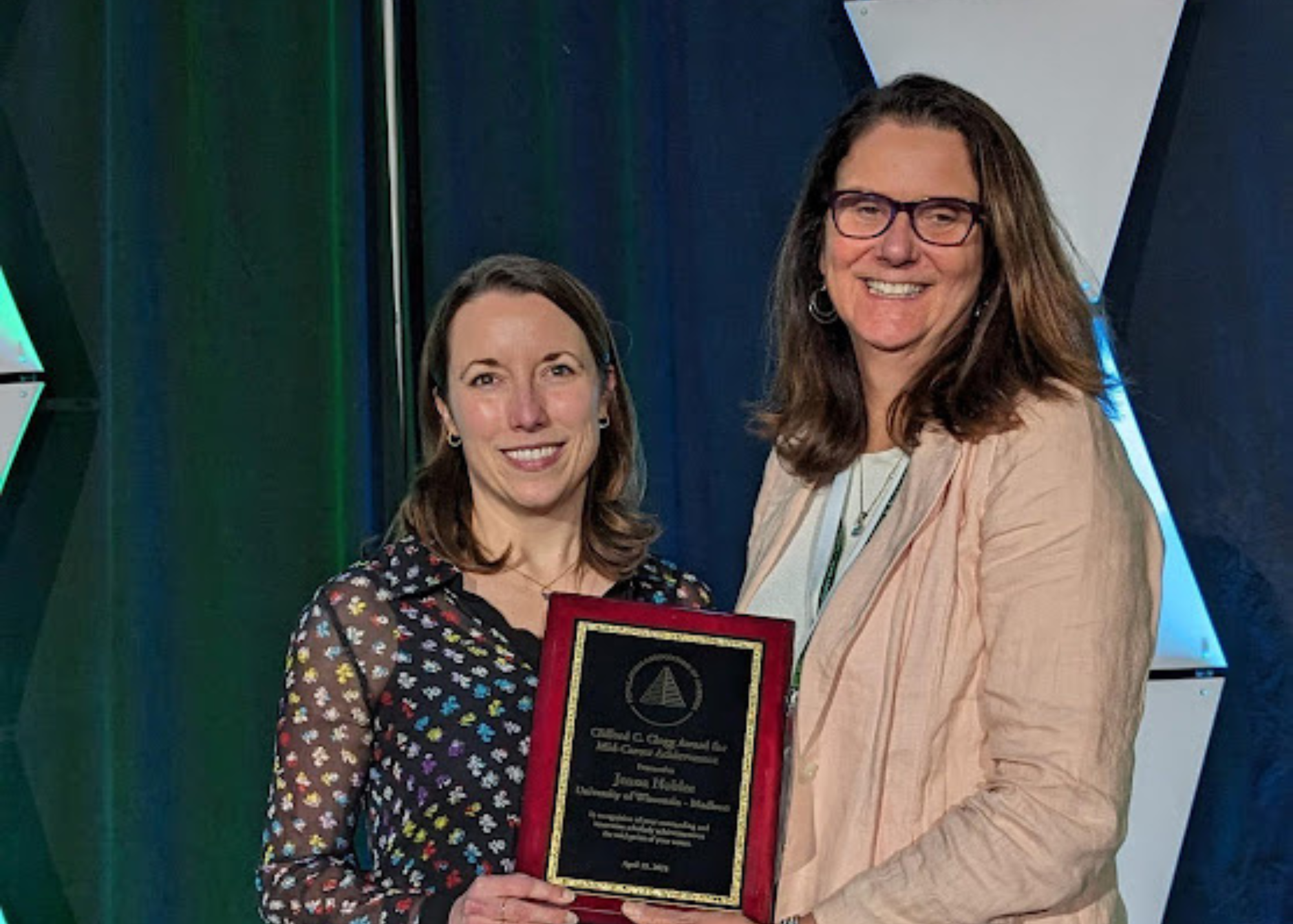 Jenna Nobles receiving the Clifford C. Clogg Award for Mid-Career Achievement at PAA.