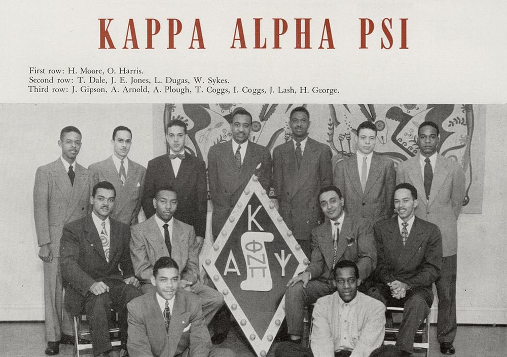 A yearbook page with a black and white photo of men posing in suits and the words "Kappa Alpha Psi"in 